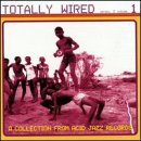 CD cover: group of people dancing in a pink-toned outdoor scene.