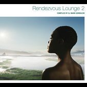 CD cover: man with headphones looking at a hazy coastal landscape.