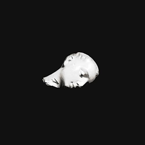 A white marble sculpture of a human head isolated against a solid black background.
