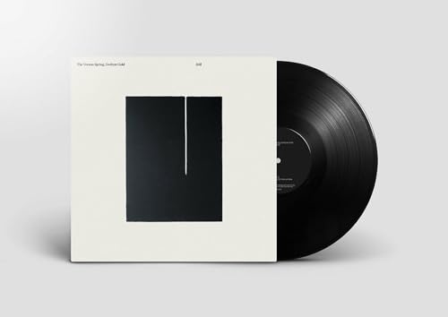 Vinyl record and album cover with black square and white background.