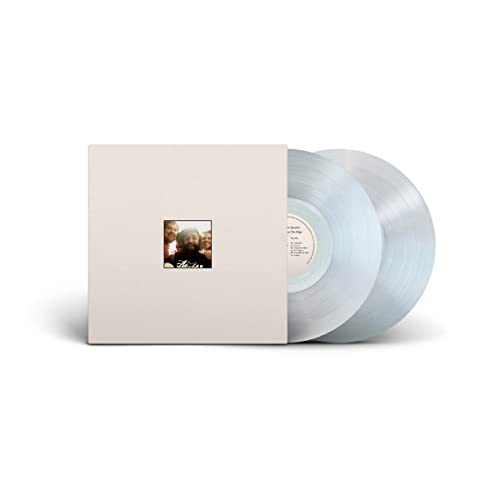 Clear vinyl record and white square album cover with a small photo.