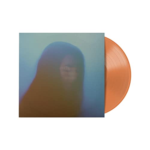 Orange vinyl record with blurred portrait album cover.
