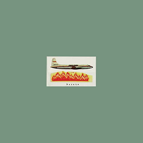 Airplane illustration above flames and the word “karate” on green background.