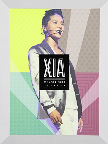 DVD cover featuring singer XIA in a suit with colorful geometric background.