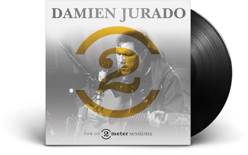 Damien Jurado album cover and black vinyl record, close-up view.