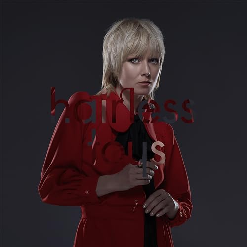 Roisin Murphy album cover: blonde woman in red coat, text overlay.