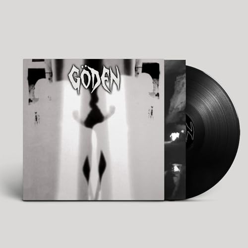 Black vinyl record with album cover featuring a distorted, shadowy figure.