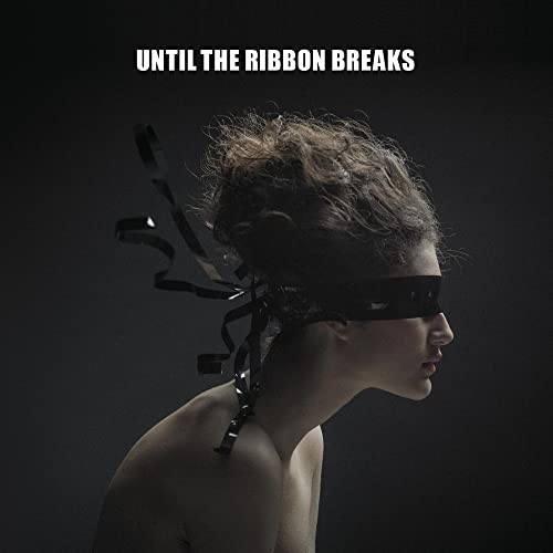 Blindfolded person with ribbons, dark background, album cover art.