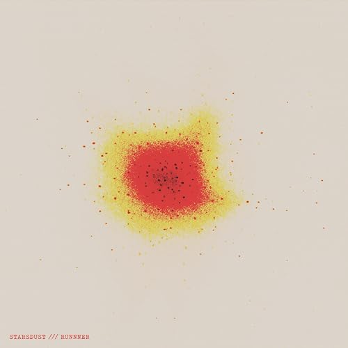 Red and yellow speckled abstract shape on a pale background.
