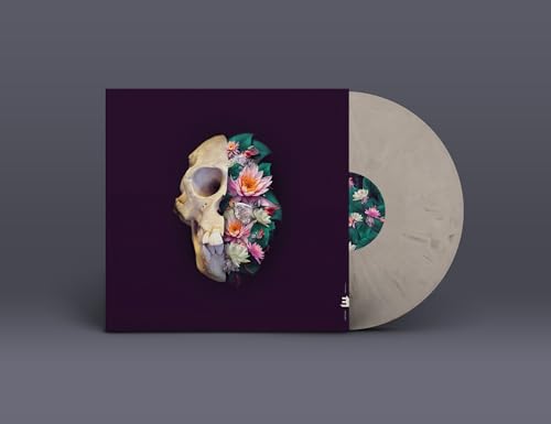Vinyl record with album art of a skull filled with colorful flowers.