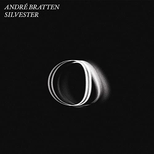 Black vinyl record cover with a blurred, circular white shape.