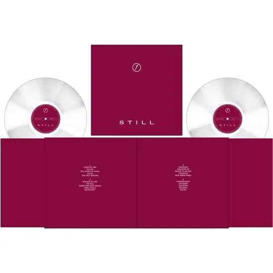 Joy Division “Still” double vinyl record with purple packaging.