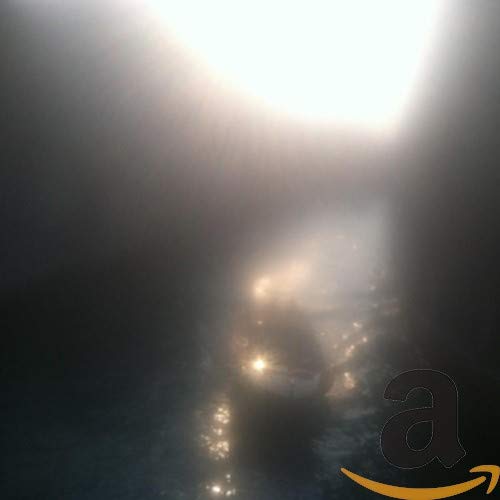 Dark abstract image with a glowing "a" logo and Amazon smile.