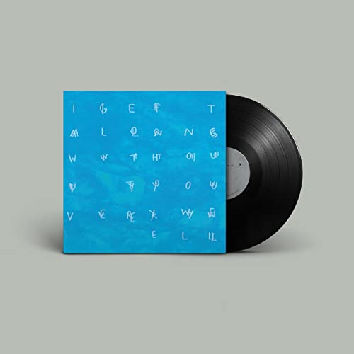 Blue vinyl record jacket with abstract white lettering and black disc.