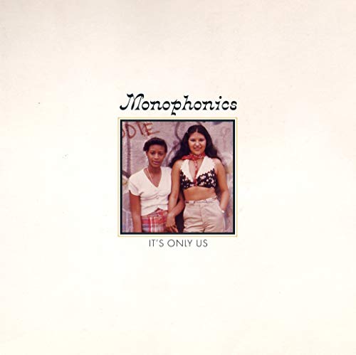 Vinyl album cover featuring two women standing in front of a graffiti wall.