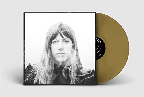 Vinyl record with gold disc and black and white portrait cover.