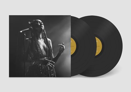 Vinyl record with album cover featuring a Black female singer at a microphone.