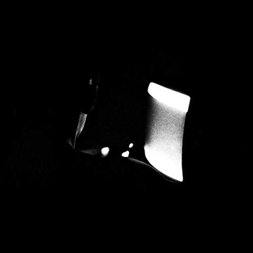 Black and white vinyl record sleeve with abstract, bright white shape.
