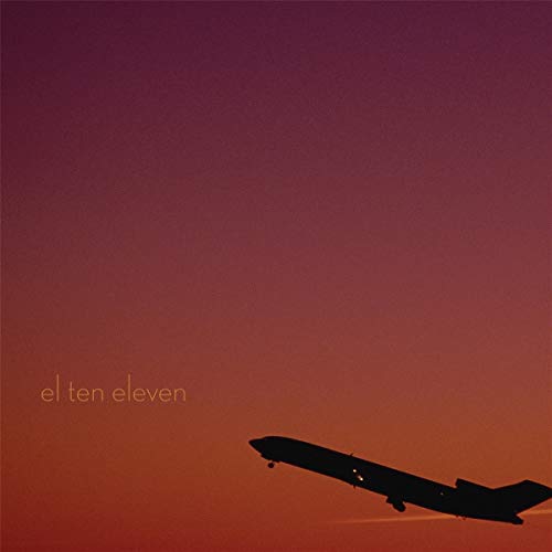 Album cover: silhouetted airplane against a gradient orange and red sky.
