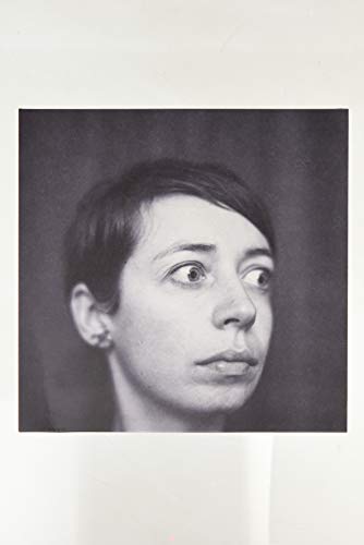 Black and white portrait of a woman with short dark hair.