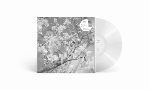 Vinyl record with a grayscale floral album cover and clear disc.