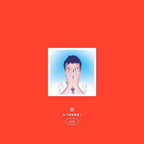 CD cover: man covering eyes, red background, text “À TERRE”.