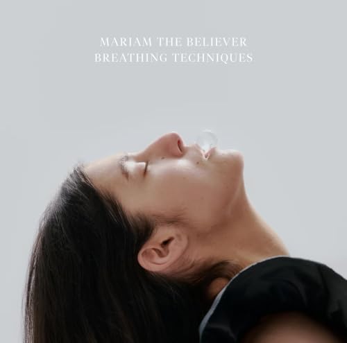 Album cover: woman looking up, exhaling a bubble, light gray background.