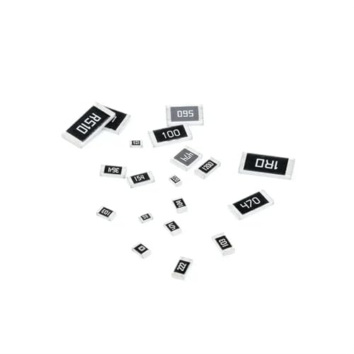Small, rectangular resistors scattered on a white surface.