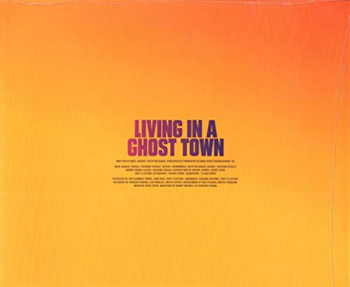 Album cover with orange-to-yellow gradient background and Living In A Ghost Town text.