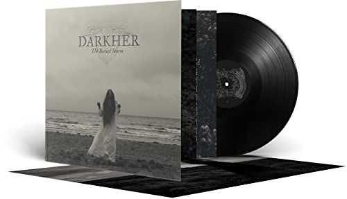 Vinyl record and cover art depicting a lone figure by the sea.