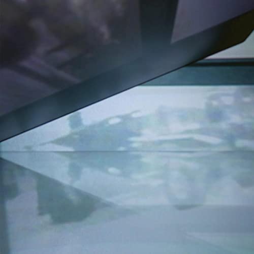 CD case with blurry image of a person and abstract shapes.