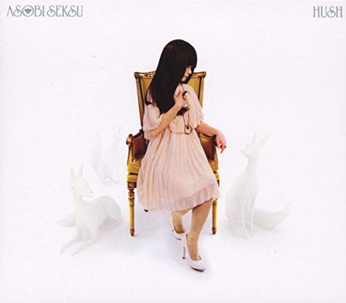 CD cover: woman in dress seated on chair with deer statues.