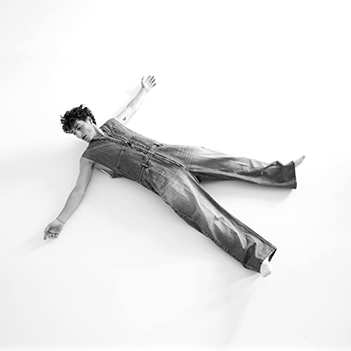 Black and white album cover featuring Benson Boone lying down.