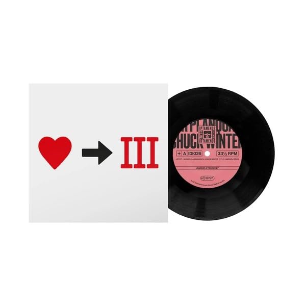 Vinyl record with red heart and arrow design on the cover.