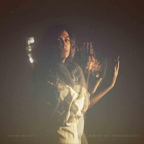A double-exposed, dark portrait of Karima Walker with text at the bottom.