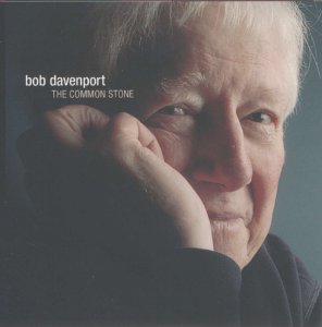 CD cover featuring a close-up portrait of an older man with gray hair.