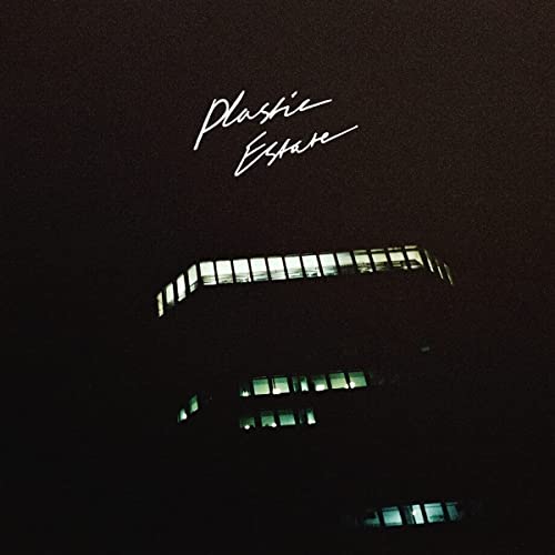 Black album cover with white text "Plastic Estate" and building image.