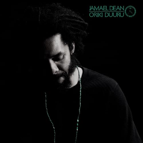 Black and white portrait of Jamael Dean with teal text and necklace.