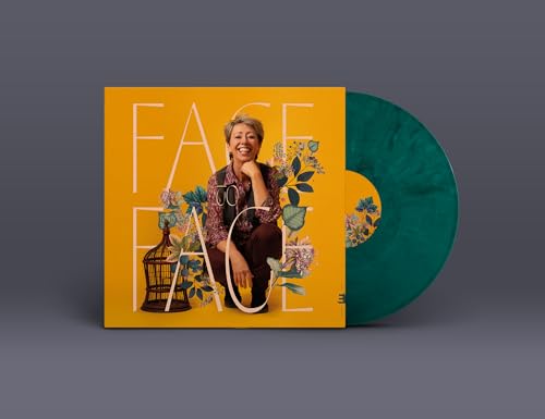 Vinyl record cover featuring a woman and floral design, with green disc.