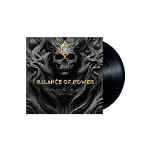 Vinyl record with album cover featuring a dark skull and band name.