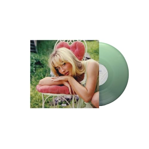 Sabrina Carpenter album cover featuring her on a pink chair beside a green vinyl.