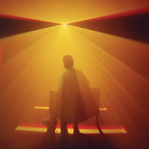 Figure in a white coat stands illuminated by bright, converging light rays.