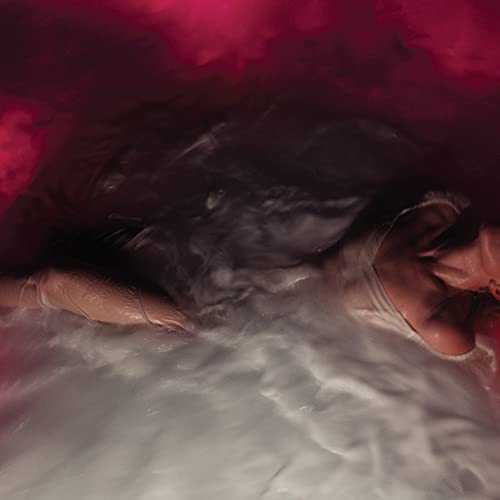 Hayley Williams submerged in pink water, eyes closed, album cover.