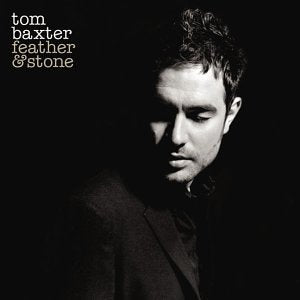 Black and white portrait of Tom Baxter, album cover “Feather & Stone”.