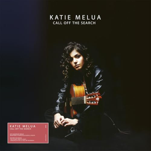Katie Melua album cover, dark background, artist with guitar.