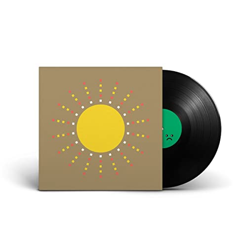 Brown album cover with yellow sun and multicolored dots, black vinyl record partially visible.
