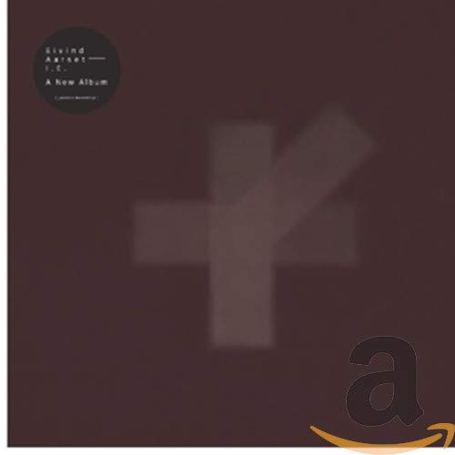 Dark maroon CD cover with abstract shapes and white text.