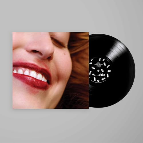 Hatchie’s “Liquorice” vinyl record with album art featuring a smiling face.