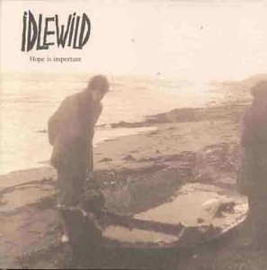 CD cover: two figures on a beach, muted sepia tones.