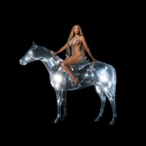 Beyoncé with long blonde hair sitting on a reflective, metallic horse against black background.